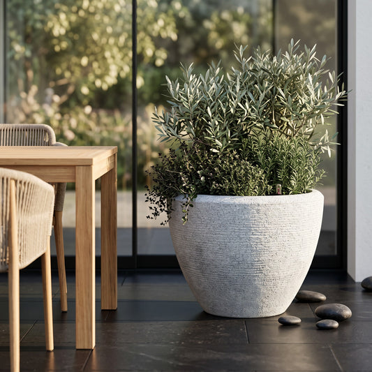 Solen Garden | Modern Lightweight Outdoor Planters LIORA 230 resin planter with matte stone texture on a patio