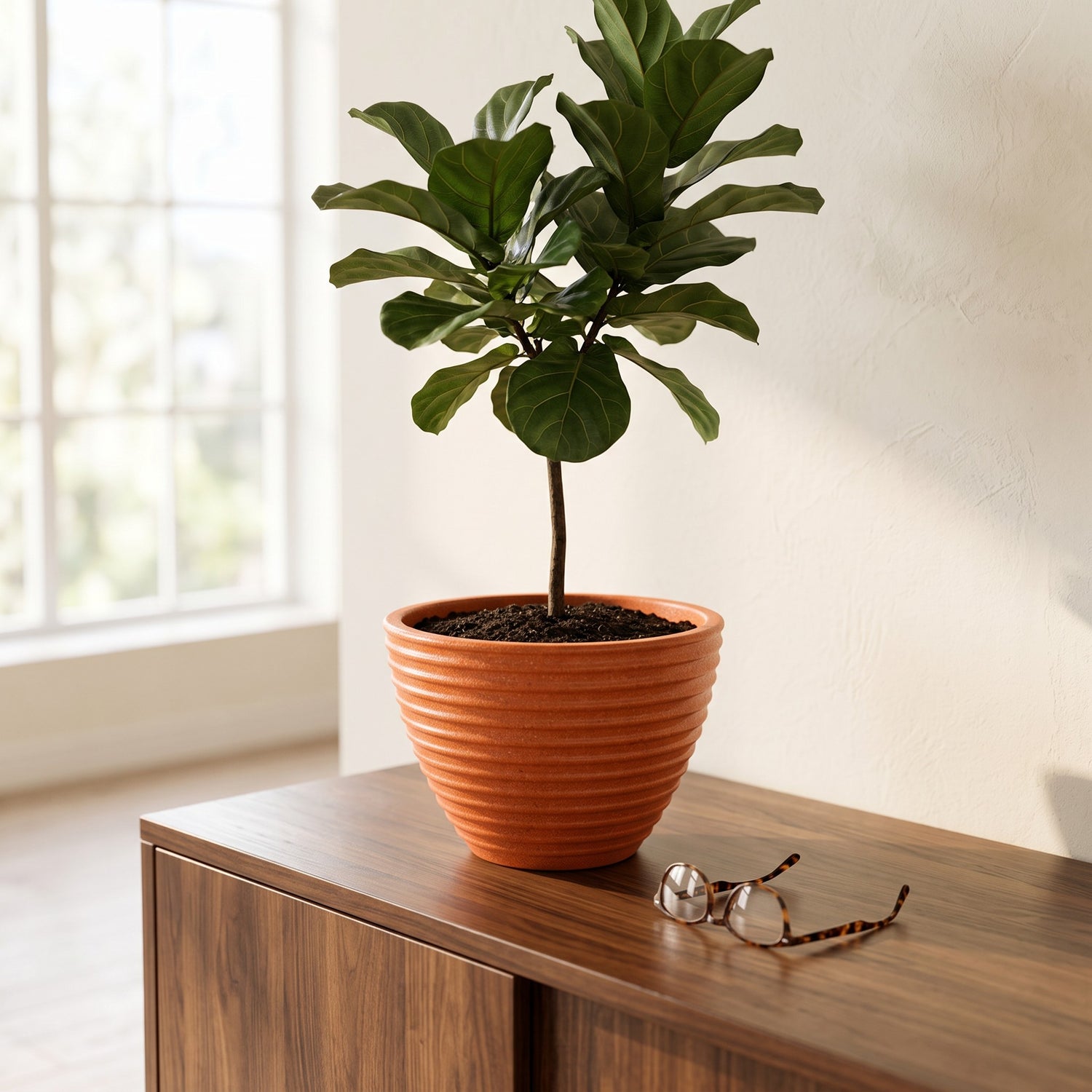 Solen Garden | Modern Lightweight Outdoor Planters LILYUM 320 terracotta-colored ribbed resin planter on a wood table